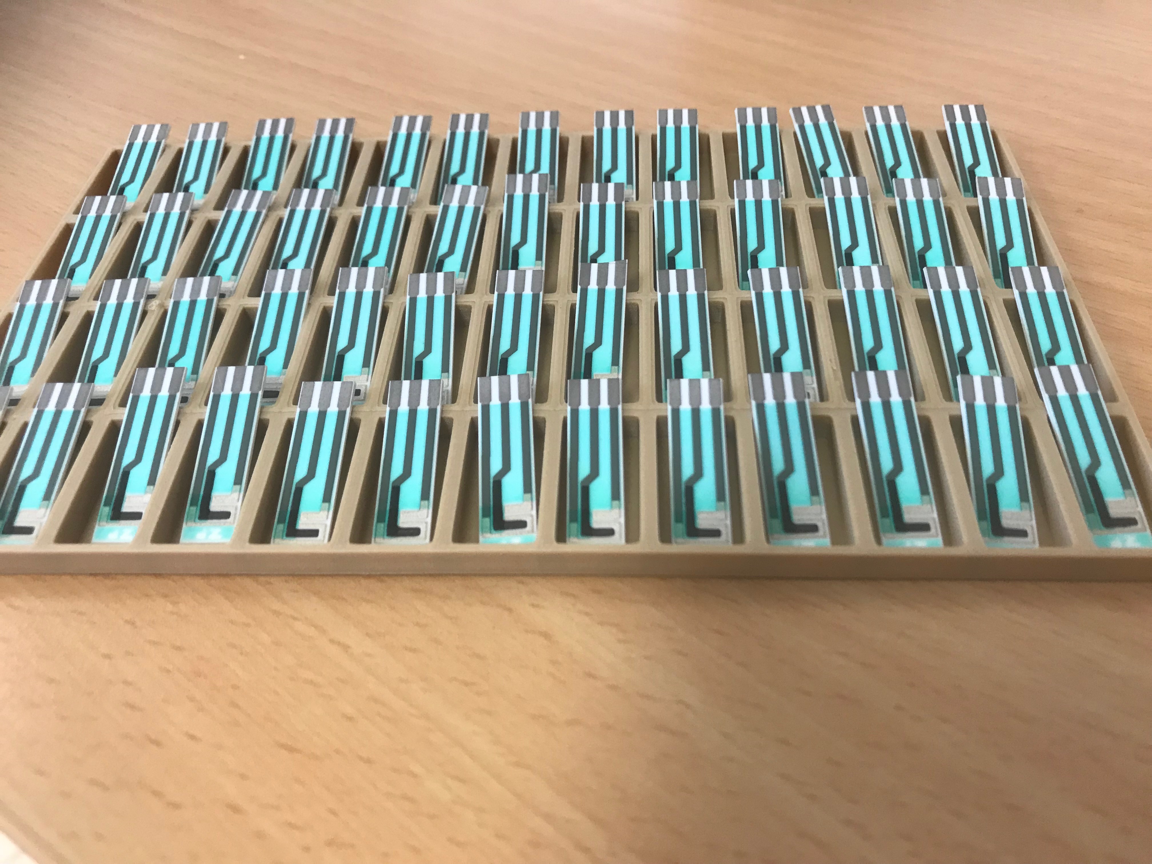 Trays of sensors and biosensors
